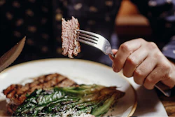 Man Eating Steak