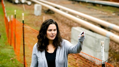 In this Tuesday, Oct. 22, 2019 photo, Carrie Gross speaks during an interview with The Associated Press along the Mariner East pipeline in Exton, Pa. The pipeline route traverses those suburbs, close to schools, ballfields and senior care facilities. 'It's absolutely traumatic and I don't say that to exaggerate or cry wolf,' said Gross, referring to the project that runs through backyards in her middle-class Philadelphia suburb of Uwchlan Township. 'It's devastated my neighborhood.'