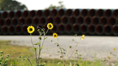 Pipes for a proposed new natural gas pipeline that would pass through the Texas Hill Country are staged near Blanco, Texas Friday, Aug. 2, 2019. A proposed pipeline is a 430-mile, $2 billion natural gas expressway that pipeline giant Kinder Morgan has mapped from the booming West Texas oil patch to Houston.