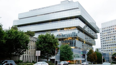 In this Sept. 12, 2019, file photo, cars pass Purdue Pharma headquarters in Stamford, Conn. Attorneys general representing nearly half the states and lawyers for more than 500 local governments on Friday, Oct. 4, 2019 blasted the terms of OxyContin maker Purdue Pharma’s offer to settle thousands of lawsuits over the toll of the nation’s opioids crisis.