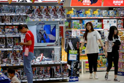 In this May 23, 2019, file photo, customers shop near a section selling Marvel Avengers toys by American toymaker Hasbro at a toy store in Beijing. The nation's business economists think President Donald Trump's trade war with China will contribute to a sharp slowdown in economic growth this year and next, raising concerns about a possible recession starting late next year.