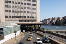 In this Sept. 26, 2019, photo, cars pass Rockefeller University in New York. Prestigious universities around the world, including Rockefeller, have accepted at least $60 million over the past five years from the family that owns the maker of OxyContin, even as the company became embroiled in lawsuits related to the opioid epidemic, financial records show. Rockefeller accepted more money from the Sacklers than any other school in recent history.