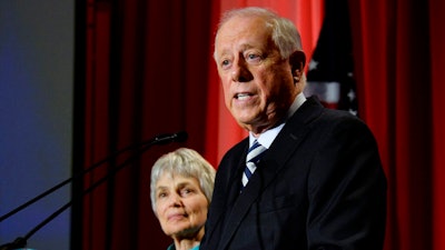 In this Nov. 6, 2018 file photo, Democratic Senate candidate, former Gov. Phil Bredesen speaks to supporters after he conceded to Rep. Marsha Blackburn, R-Tenn., in their race for the U.S. Senate in Nashville, Tenn., as his wife Andrea Conte stands next to him. A new business venture by Bredesen takes on global warming by helping companies fund solar panels in communities with dirty-power electric grids. The Democrat plans to introduce Clearloop on Tuesday, Oct. 22, 2019, at a conference headlined by former New York Mayor Michael Bloomberg. It's Bredesen's first big public foray since losing a U.S. Senate bid last year.