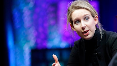 In this Monday, Nov. 2, 2015 file photo, Elizabeth Holmes, founder and CEO of Theranos, speaks at the Fortune Global Forum in San Francisco. Elizabeth Holmes, who ran Theranos until its 2018 collapse, hasn't paid her Palo Alto, California, attorney John Dwyer and his colleagues for the past year, according to documents filed Monday, Sept. 30, 2019 in Phoenix federal court.