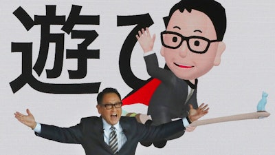 Toyota Motor Corp. President Akio Toyoda speaks during Toyota's presentation of the media preview of the Tokyo Motor Show in Tokyo Wednesday, Oct. 23, 2019. The Japanese letters in the background read: 'Play.'