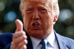 In this Oct. 4, 2019, file photo, President Donald Trump talks to reporters on the South Lawn of the White House, in Washington. The nation's business economists think President Trump's trade war with China will contribute to a sharp slowdown in economic growth this year and next, raising concerns about a possible recession starting late next year.