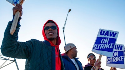 Motorline worker Ray Gladney of Florrisant, materials worker Brookes Robinson of Central West End, and Trim Doorline Worker Danielle Harris of Richmond Heights, picket at the General Motors plant in Wentzville, Mo., on Tuesday, Oct. 22, 2019. United Auto Workers around the country will be voting on whether to accept or deny the recent offer made to the union by GM in the coming week.