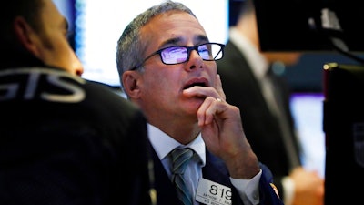 Specialist Anthony Rinaldi works on the floor of the New York Stock Exchange, Tuesday, Oct. 8, 2019. Stocks are opening lower on Wall Street as tensions rose between Washington and Beijing just ahead of the latest round of trade talks.