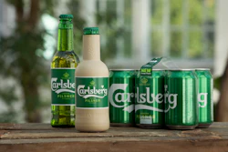 In this undated handout photo provided by Carlsberg, the new paper bottle is seen in Denmark. Danish brewer Carlsberg says it is developing a paper beer bottle made from sustainably sourced wood fibers. The Copenhagen-based company unveiled Friday, Oct. 11, 2019 two new prototypes that are 'fully recyclable and have an inner barrier to allow the bottles to contain beer.'
