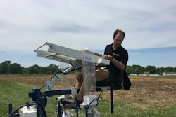 Professor Tim Beissinger on a tractor during the planting phase of the experiment.