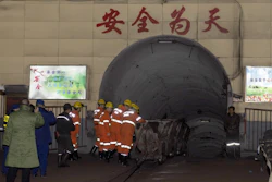 In this photo released by China's Xinhua News Agency, rescuers enter a coal mine that was the site of a gas explosion in Pingyao county in northern China's Shanxi Province on Tuesday, Nov. 19.