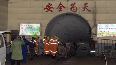 In this photo released by China's Xinhua News Agency, rescuers enter a coal mine that was the site of a gas explosion in Pingyao county in northern China's Shanxi Province on Tuesday, Nov. 19.