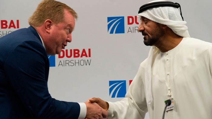 Boeing Commercial Airplanes president and CEO Stanley A. Deal, left, shakes hands with Sheikh Ahmed bin Saeed Al Maktoum, the chairman and CEO of the Dubai-based long-haul carrier Emirates, at the Dubai Airshow in Dubai, United Arab Emirates on Wednesday, Nov. 20.