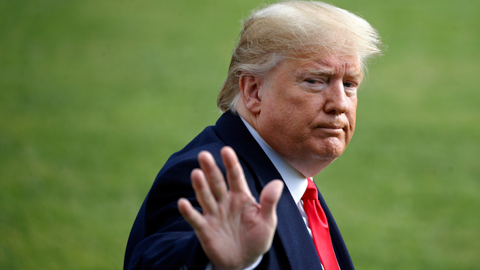 President Donald Trump waves as he walks to the Marine One helicopter after speaking to the media on Wednesday, Nov. 20, as he leaves the White House in Washington, en route to Texas.