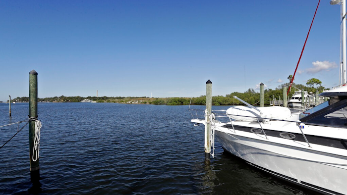 In this Nov. 30, 2017 photo, boats are shown moored in the Anclote River near the old Stauffer chemical plant site in Tarpon Springs, Fla. Hundreds of the nation's most polluted places are at an increasing risk of spreading contamination beyond their borders by more frequent storms and rising seas. Sixty percent of U.S. Superfund sites are in danger from weather extremes like hurricanes or wildfires, and the Trump administration’s reluctance to acknowledge and plan for climate change is hurting chances of safeguarding them, according to a government watchdog.