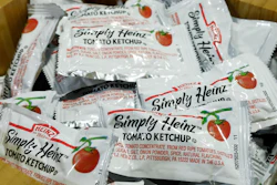 In this Aug. 8, 2019 file photo, packets of Simply Heinz ketchup fill a cafeteria condiment box in New York.
