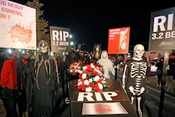 A ghoulish group of pallbearers stand in front of a casket representing 3.2% beer on Wednesday, Oct. 30 in Salt Lake City. After 86 years, this Halloween marks the last day 3.2% beer will be sold in Utah stores. Beginning Nov. 1, Utah stores will be selling up to 5% ABV beer, and Budweiser wants to celebrate with a funeral complete with their famous Clydesdales, in the background.