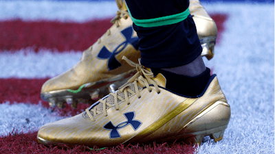 In this Dec. 10, 2017 file photo, Jacksonville Jaguars running back T.J. Yeldon warms up wearing Under Armour cleats before an NFL football game against the Seattle Seahawks in Jacksonville, FL.
