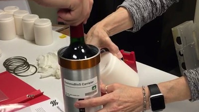 In this Nov. 2 photo provided by Space Cargo Unlimited, researchers with Space Cargo Unlimited prepare bottles of French red wine to be flown aboard a Northrop Grumman capsule from Wallops Island, VA, to the International Space Station. The wine will age for a year up there before returning to the Luxembourg company.