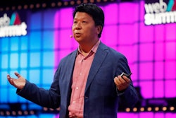 Huawei Rotating Chairman Guo Ping addresses attendees at the Web Summit technology conference in Lisbon on Monday, Nov. 4.