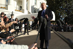 President Donald Trump speaks to reporters on the South Lawn of the White House in Washington on Friday before boarding Marine One for a short trip to Andrews Air Force Base, Md. and then on to Georgia to meet with supporters.