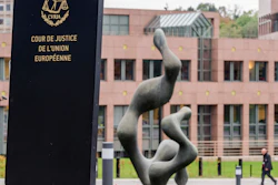 In this Oct. 5, 2015 file photo, a man walks by the European Court of Justice in Luxembourg. The European Court of Justice said in a statement issued Tuesday, Nov. 12, that “foodstuffs originating in the territories occupied by the State of Israel must bear the indication of their territory of origin.” with special labels indicating that provenance.