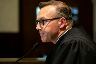 In this Aug. 26, 2019 file photo, Judge Thad Balkman reads a summary of his decision in the opioid trial at the Cleveland County Courthouse in Norman, OK.