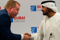 Boeing Commercial Airplanes president and CEO Stanley A. Deal, left, shakes hands with Sheikh Ahmed bin Saeed Al Maktoum, the chairman and CEO of the Dubai-based long-haul carrier Emirates, at the Dubai Airshow in Dubai, United Arab Emirates on Wednesday, Nov. 20.