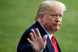 President Donald Trump waves as he walks to the Marine One helicopter after speaking to the media on Wednesday, Nov. 20, as he leaves the White House in Washington, en route to Texas.