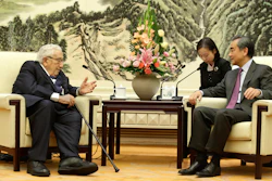 Chinese Foreign Minister Wang Yi meets former U.S. Secretary of State Henry Kissinger at the Great Hall of the People in Beijing on Friday, Nov. 22.