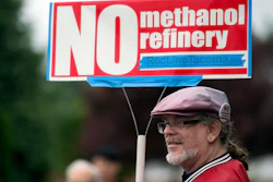 In this 2017 file photo, Mark Keely, of Kalama, WA stands with other protesters outside the Washington Department of Ecology's Vancouver field office.