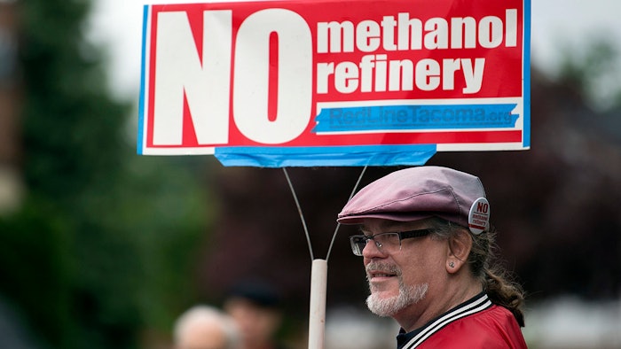 In this 2017 file photo, Mark Keely, of Kalama, WA stands with other protesters outside the Washington Department of Ecology's Vancouver field office.