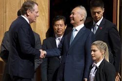 In this Oct. 11, 2019, file photo, Chinese Vice Premier Liu He, center right, shakes hands with U.S. Trade Representative Robert Lighthizer, center left, after a minister-level trade meeting at the Office of the United States Trade Representative in Washington.