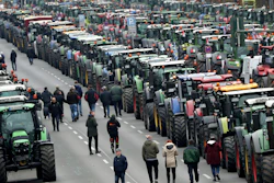 Farmers have parked their tractors on a road between the university and the Brandenburg Gate in Berlin, Germany on Tuesday, Nov. 26.