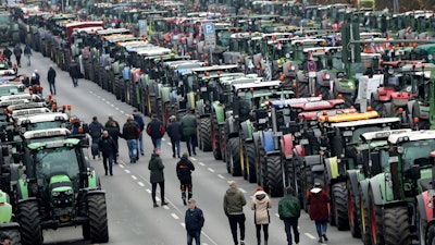 Farmers have parked their tractors on a road between the university and the Brandenburg Gate in Berlin, Germany on Tuesday, Nov. 26.