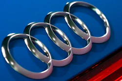 In this file photo dated Thursday, March 14, 2019, the logo of the German car manufacturer Audi is pictured on a Audi e-tron prior to the annual press conference in Ingolstadt, Germany. The Ingolstadt-based automaker said Tuesday Nov. 26, 2019, that it expected to add 2,000 new positions while Volkswagen subsidiary Audi says it is cutting 9,500 jobs in Germany through 2025.