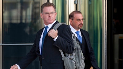 Douglas Haig, left, and his attorney Marc Victor leave the Lloyd George Federal Courthouse, Tuesday Nov. 19, 2019, in Las Vegas, after pleading guilty to illegally manufacturing tracer and armor-piercing bullets found in a high-rise hotel suite where a gunman took aim before the Las Vegas Strip massacre two years ago. Haig is a 57-year-old aerospace engineer who used to reload bullets at home in Mesa, Airz., and sell them at gun shows. He isn’t accused of a direct role in the Oct. 1, 2017, shooting that killed 58 people and injured hundreds at an open-air music festival.