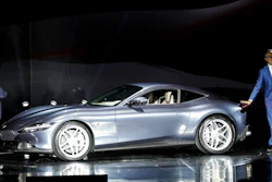 Ferrari Chief Marketing and Commercial Officer, Enrico Galliera, left, and Ferrari design senior vice President, Flavio Manzoni, present the new Ferrari Roma car, in Rome, Thursday, Nov. 14, 2019. Ferrari unveils a new sports coupe aimed at enticing entry-level buyers and competing with the Porsche 911, part of a complete refresh of its model lineup by 2022.