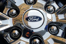In this Feb. 14, 2019, file photo a wheel on a 2019 Ford Expedition 4x4 is displayed at the 2019 Pittsburgh International Auto Show in Pittsburgh. Members of the United Auto Workers union at Ford Motor Co. have voted to approve a new contract with the company. The union says in a statement Friday, Nov. 15, 2019, that 56.3% of workers who voted were in favor of the deal.