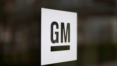 This May 16, 2014, file photo, shows the General Motors logo at the company's world headquarters in Detroit. General Motors is suing Fiat Chrysler, alleging that its crosstown rival got an unfair business advantage by bribing officials of the United Auto Workers union. The lawsuit, filed Wednesday, Nov. 20, 2019, in U.S. District Court in Detroit, alleges that FCA was involved in racketeering by paying millions in bribes to get concessions and gain advantages in three labor agreements with the union.