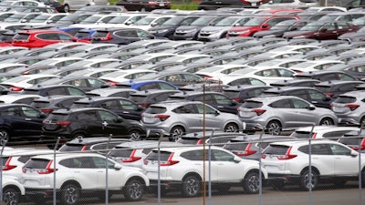 In this July 8, 2019, photo, Honda cars wait to be exported at Yokohama port, near Tokyo. Honda recorded a 6.7% decline in July-September profit as vehicle and motorcycle sales slipped and an unfavorable exchange rate hurt earnings at the Japanese automaker, Honda Motor Co. reported Friday, Nov. 8, 2019.