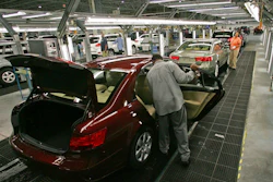 In this Feb 1, 2008, file photo, Hyundai Motor Company employees put the finishing touches on vehicles in Montgomery, Ala. Hyundai will build a pickup-style sport-utility vehicle at its plant in Alabama, which the company said Wednesday, Nov. 13, 2019, is being enlarged in a $410 million expansion project.
