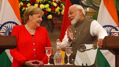 Indian Prime Minister Narendra Modi, right, talks with German Chancellor Angela Merkel during a signing of agreements ceremony between the two countries, in New Delhi, India, Friday, Nov. 1, 2019. India and Germany have agreed to enhance cooperation in tackling climate change, cybersecurity, skill development, artificial intelligence, energy security, civil aviation and defense production. The two countries signed several agreements on Friday, with Prime Minister Narendra Modi saying India is eager to benefit from Germany's expertise.