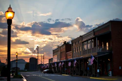 In this Aug. 23, 2015 file photo, the sun rises behind Main Street in Plains, Ga. The market for small businesses cooled further during the third quarter as fallout from trade wars made companies look less appealing to buyers.