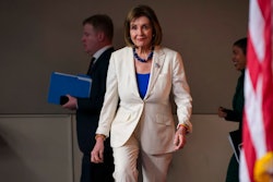 Speaker of the House Nancy Pelosi, D-Calif., arrives to talk to reporters as the House Intelligence Committee holds public impeachment hearings of President Donald Trump's efforts to tie U.S. aid for Ukraine to investigations of his political opponents. Pelosi says there is clear evidence that President Donald Trump has used his office for his personal gain. She says doing that 'undermined the national security of the United States.'