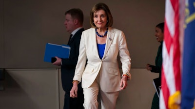 Speaker of the House Nancy Pelosi, D-Calif., arrives to talk to reporters as the House Intelligence Committee holds public impeachment hearings of President Donald Trump's efforts to tie U.S. aid for Ukraine to investigations of his political opponents. Pelosi says there is clear evidence that President Donald Trump has used his office for his personal gain. She says doing that 'undermined the national security of the United States.'