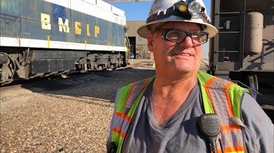 In this Aug. 20, 2019, image, Navajo Generating Station employee and former mayor Lyle Dimbatt answers questions about the planned closure of the coal-fired power plant near Page, Ariz. The power plant will close before the year ends, upending the lives of hundreds of mostly Native American workers who mined coal, loaded it and played a part in producing electricity that powered the American Southwest.