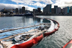In this photo provided by the U.S. Coast Guard, their crews and other local agencies respond to an oil discharge from vessel Kamokuiki at Pier 19 in Honolulu, Thursday, Nov. 7, 2019. Two response vessels arrived on scene and deployed 1,600 feet of hard boom surrounding the 25 bales of absorbent material.