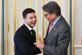 In this May 20, 2019, file photo, Ukrainian President Volodymyr Zelenskiy, left, and Energy Secretary Rick Perry share a joke during their meeting in Kiev, Ukraine.