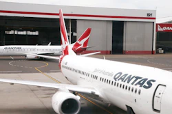 In this Feb. 26, 2015, file photo, a Qantas 737 plane maneuvers behind another 737 parked at a gate at Sydney Airport in Sydney. Qantas on Wednesday, Oct. 31, 2019, said it had found cracking in one 737, following calls from the US Federal Aviation Administration for all airlines to check their fleets of the aircraft.